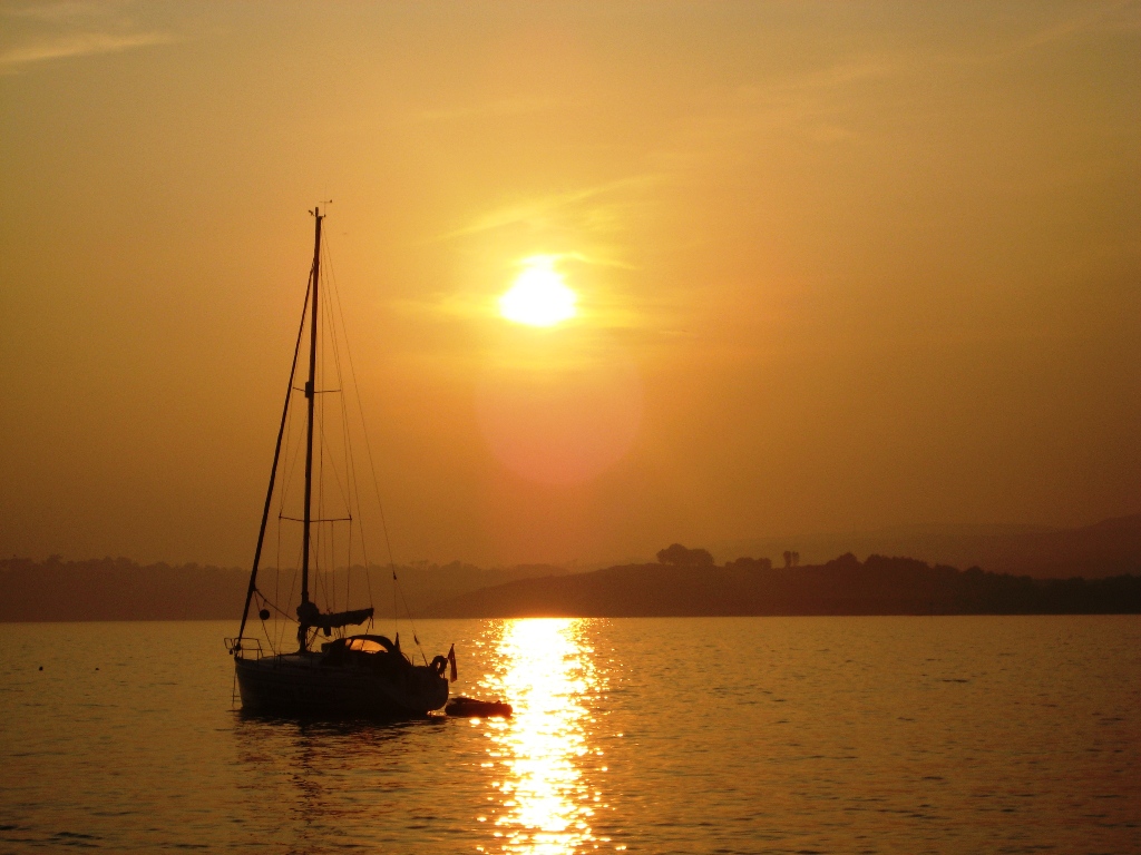 Photo of a boat at sunset